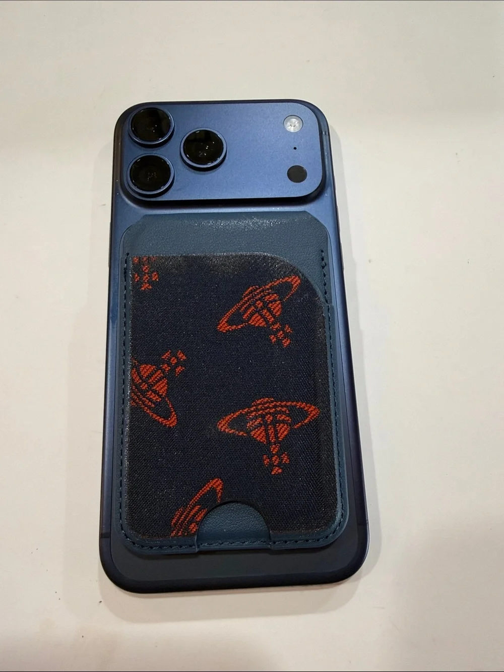 Upcycled Vivienne Westwood Black and Orange Planet Motif Card Phone Sleeve